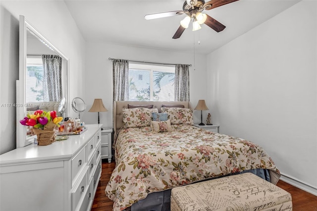 bedroom featuring dark hardwood / wood-style flooring and ceiling fan