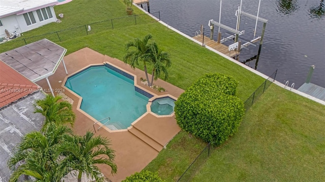 view of pool featuring a patio area, an in ground hot tub, a dock, and a water view