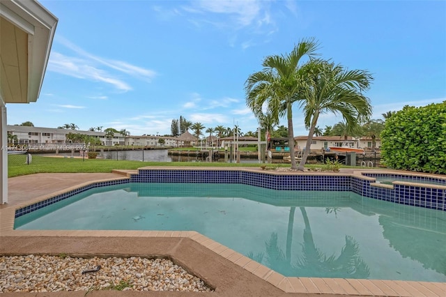 view of pool with a water view and an in ground hot tub