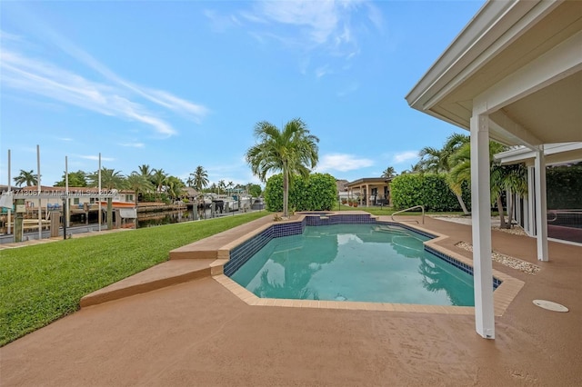 view of pool with a yard, a water view, and a dock