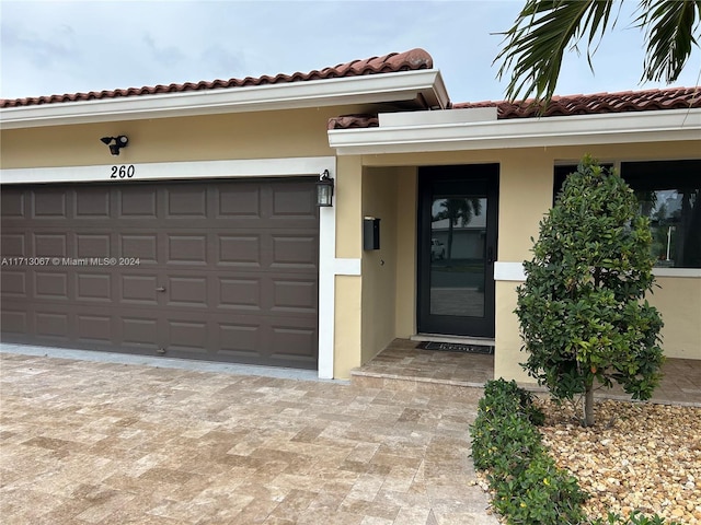 property entrance featuring a garage