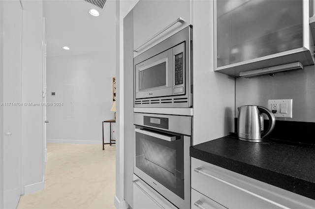 kitchen featuring white cabinets and stainless steel appliances