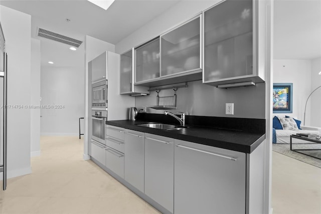 kitchen with sink and appliances with stainless steel finishes