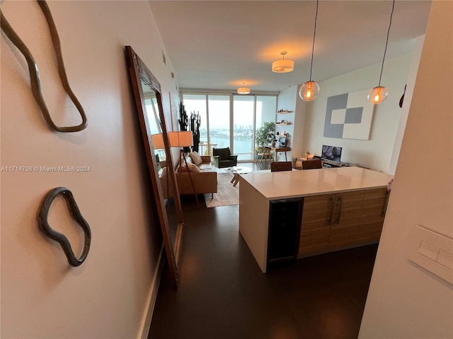 kitchen featuring hanging light fixtures and expansive windows