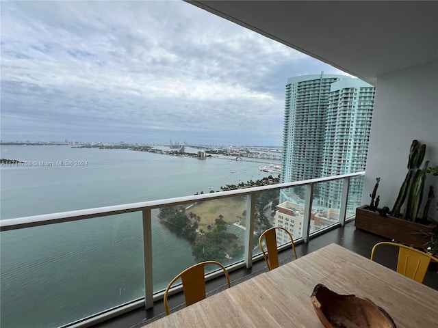 balcony featuring a water view