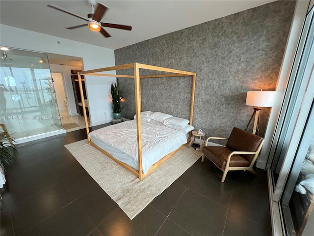 bedroom with ceiling fan and dark tile patterned flooring