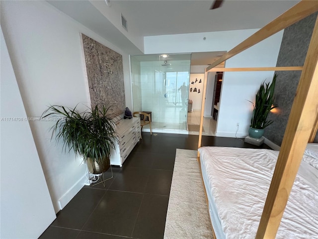 bedroom featuring dark tile patterned flooring