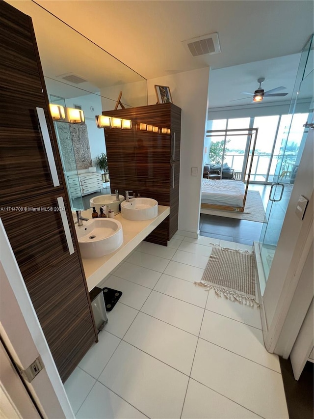 bathroom featuring ceiling fan, tile patterned flooring, and vanity