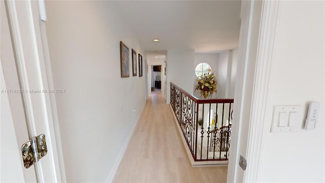 hallway with light wood-type flooring