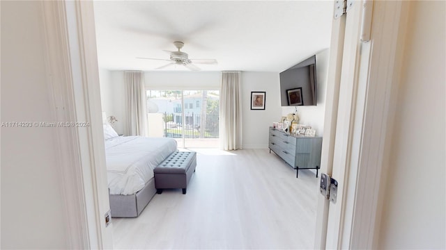 bedroom featuring ceiling fan, access to exterior, and light hardwood / wood-style flooring