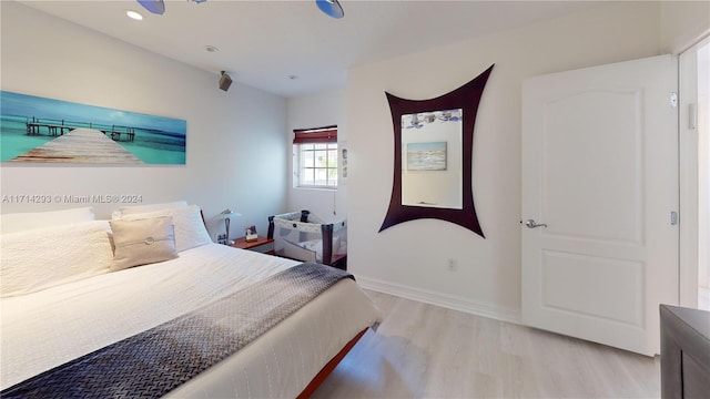 bedroom with light hardwood / wood-style flooring