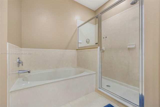 bathroom with tile patterned flooring and plus walk in shower