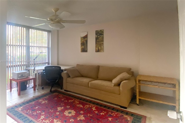 living room featuring ceiling fan and tile patterned flooring