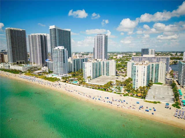 aerial view featuring a water view and a beach view