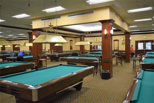 playroom featuring carpet flooring, a paneled ceiling, ornate columns, and pool table