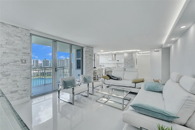 tiled living room featuring expansive windows