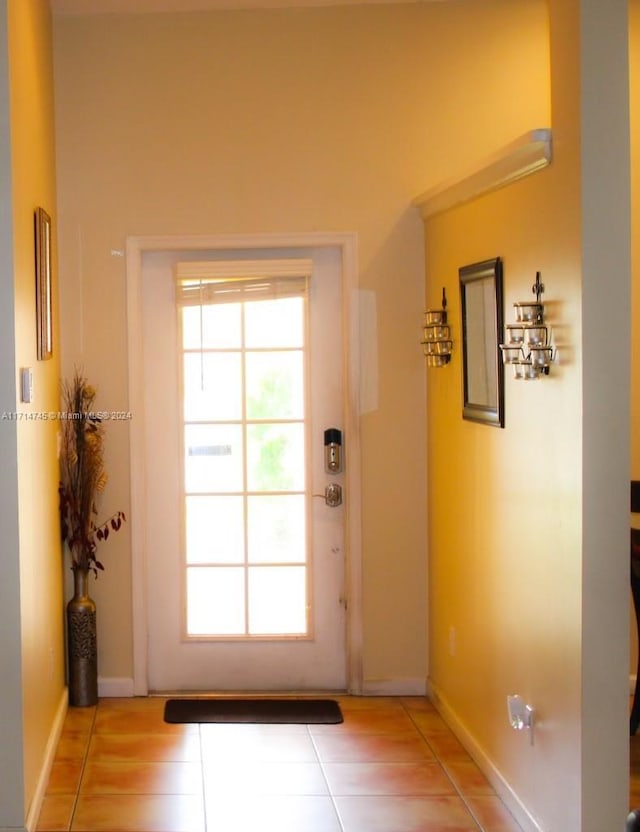 entryway with tile patterned flooring and a wealth of natural light