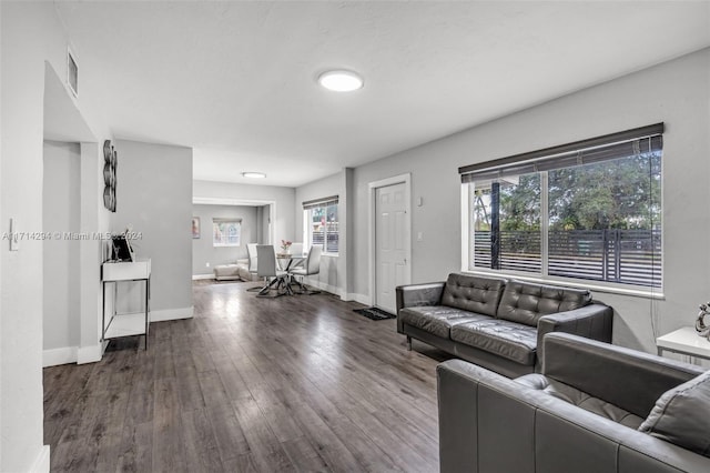 living room with dark wood-type flooring