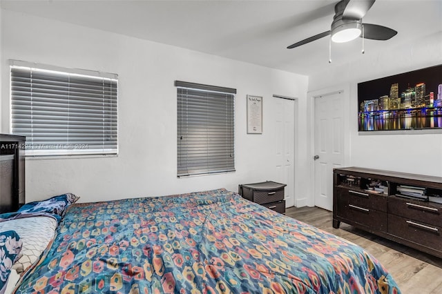 bedroom with ceiling fan and light hardwood / wood-style flooring