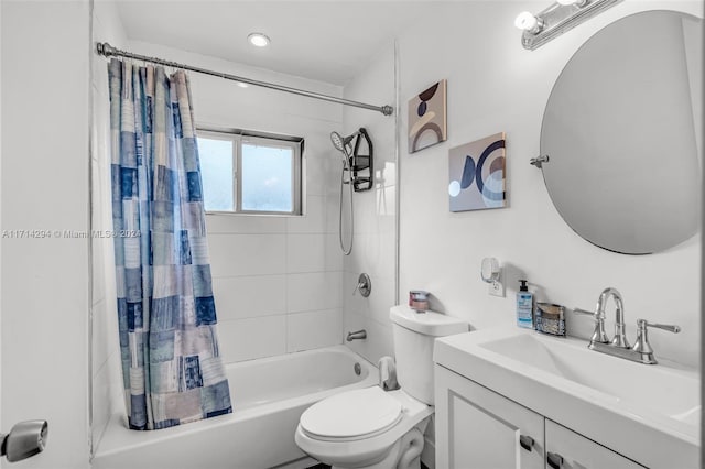 full bathroom with shower / bath combo, vanity, and toilet