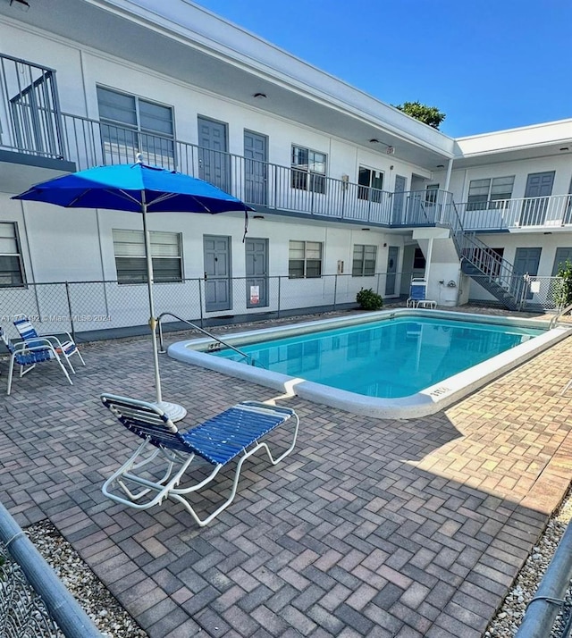 view of swimming pool featuring a patio