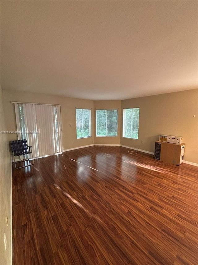 spare room with hardwood / wood-style flooring