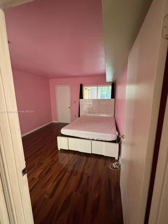 unfurnished bedroom featuring dark hardwood / wood-style floors