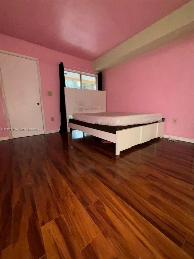 unfurnished bedroom with hardwood / wood-style floors