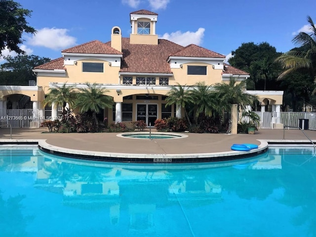 view of pool featuring a community hot tub