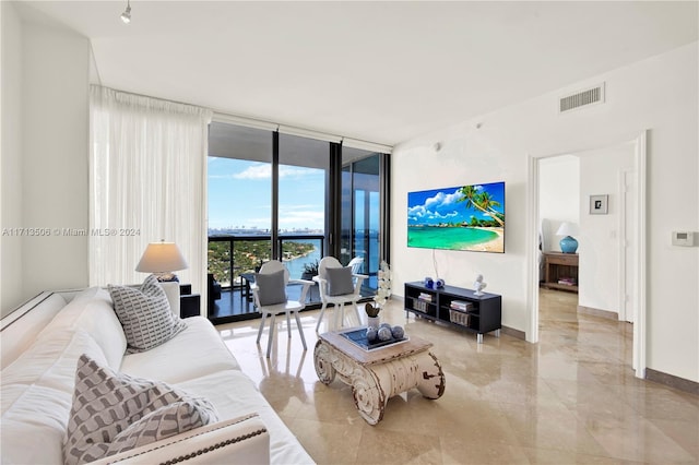 living room with floor to ceiling windows