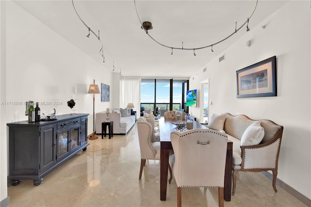 dining room featuring floor to ceiling windows