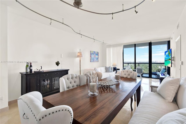 dining room featuring floor to ceiling windows