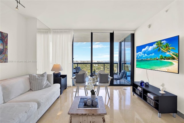 living room featuring floor to ceiling windows