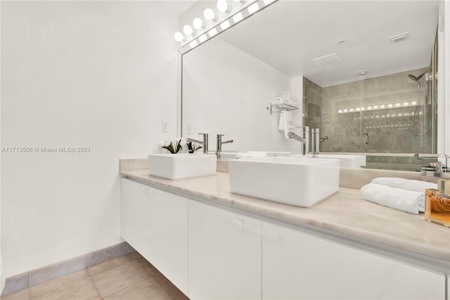 bathroom with vanity, tile patterned floors, and a shower with shower door