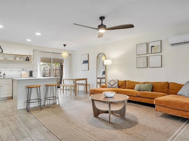 living room featuring a wall mounted AC and ceiling fan