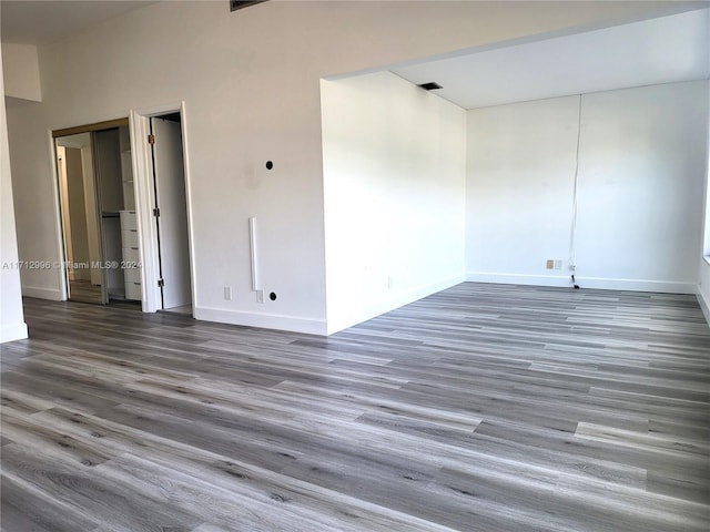 unfurnished room featuring dark hardwood / wood-style floors