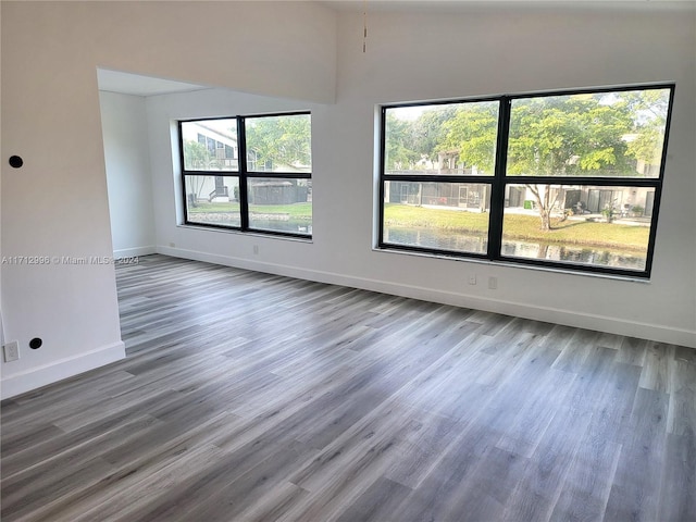 spare room with hardwood / wood-style flooring