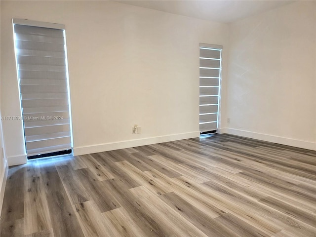 unfurnished room with light hardwood / wood-style floors