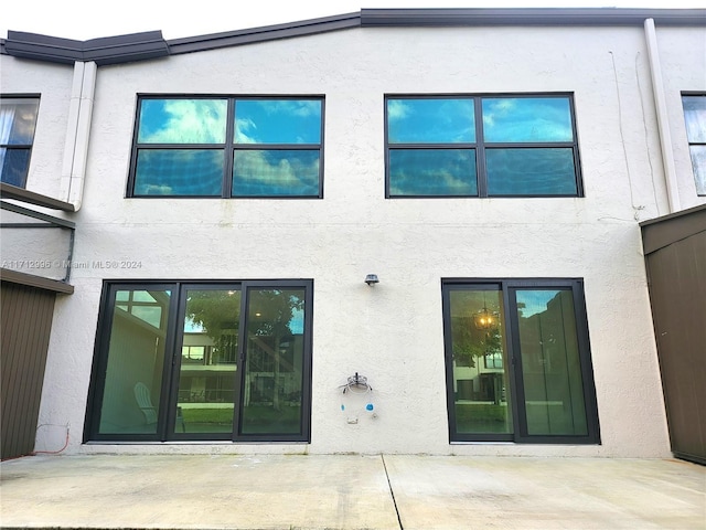 back of house featuring a patio area