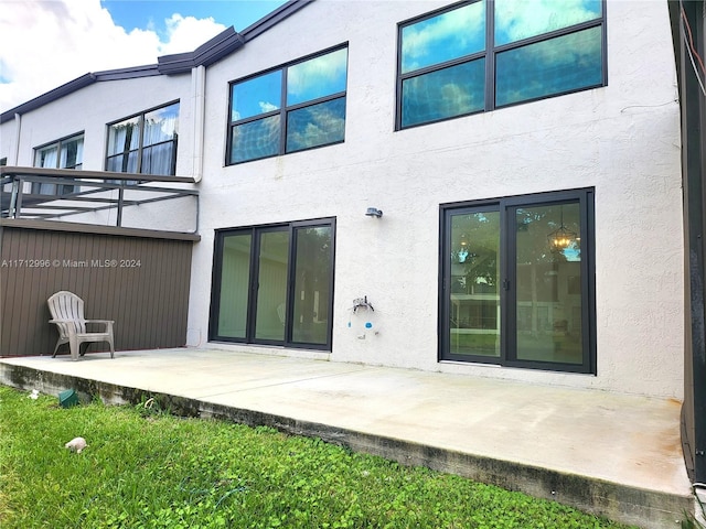 rear view of house with a patio area