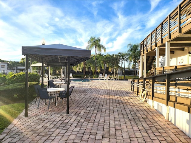 view of home's community with a gazebo, a patio, and a pool