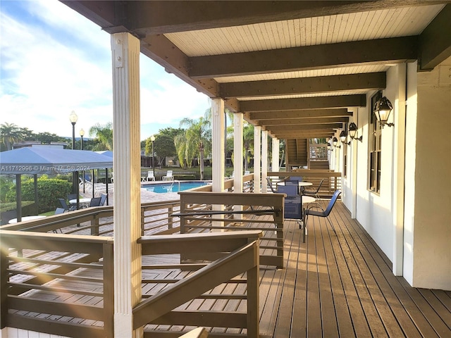 deck featuring a community pool