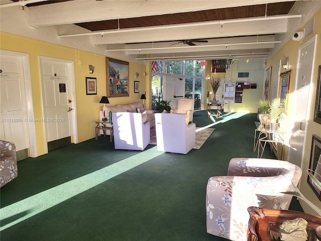 living room featuring carpet flooring and beamed ceiling