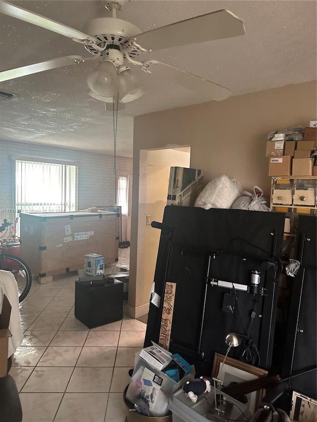 bedroom featuring ceiling fan and light tile patterned floors