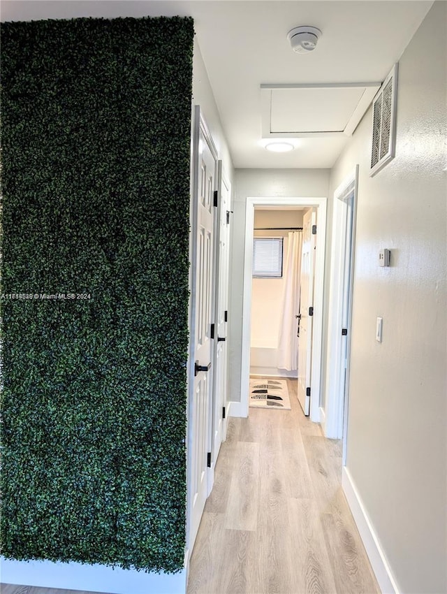 hallway with light wood-type flooring