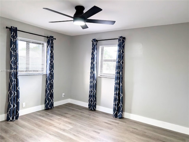 unfurnished room with ceiling fan and light hardwood / wood-style flooring