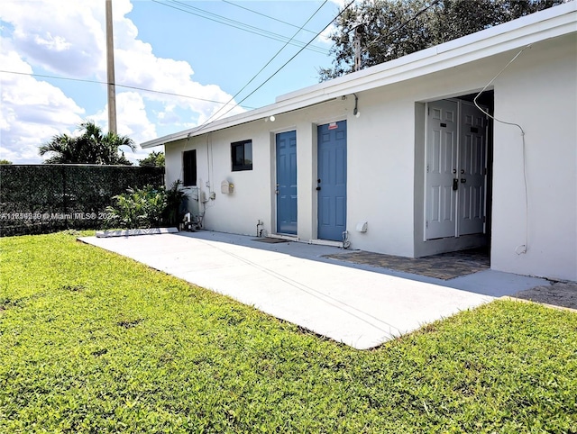 exterior space with a yard and a patio