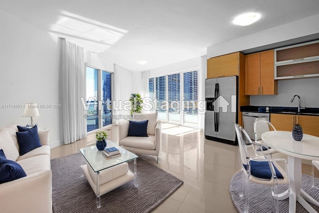 60 SW 13th St Unit 1700, Miami, FL 33130 - living area featuring baseboards, light tile patterned floors, and french doors