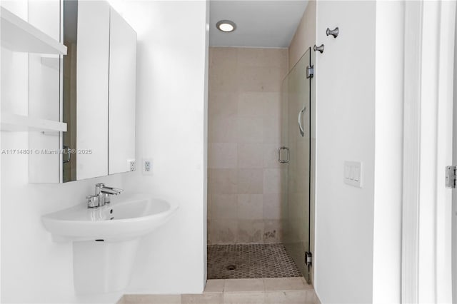 bathroom with a shower stall