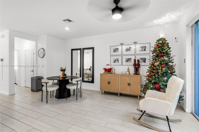 dining room with visible vents, baseboards, and a ceiling fan